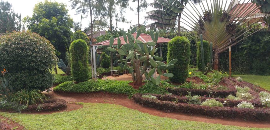 Prime 1 Acre Parcel of Land with an Extremely Clean 8 Bedrooms House in Runda for Sale.